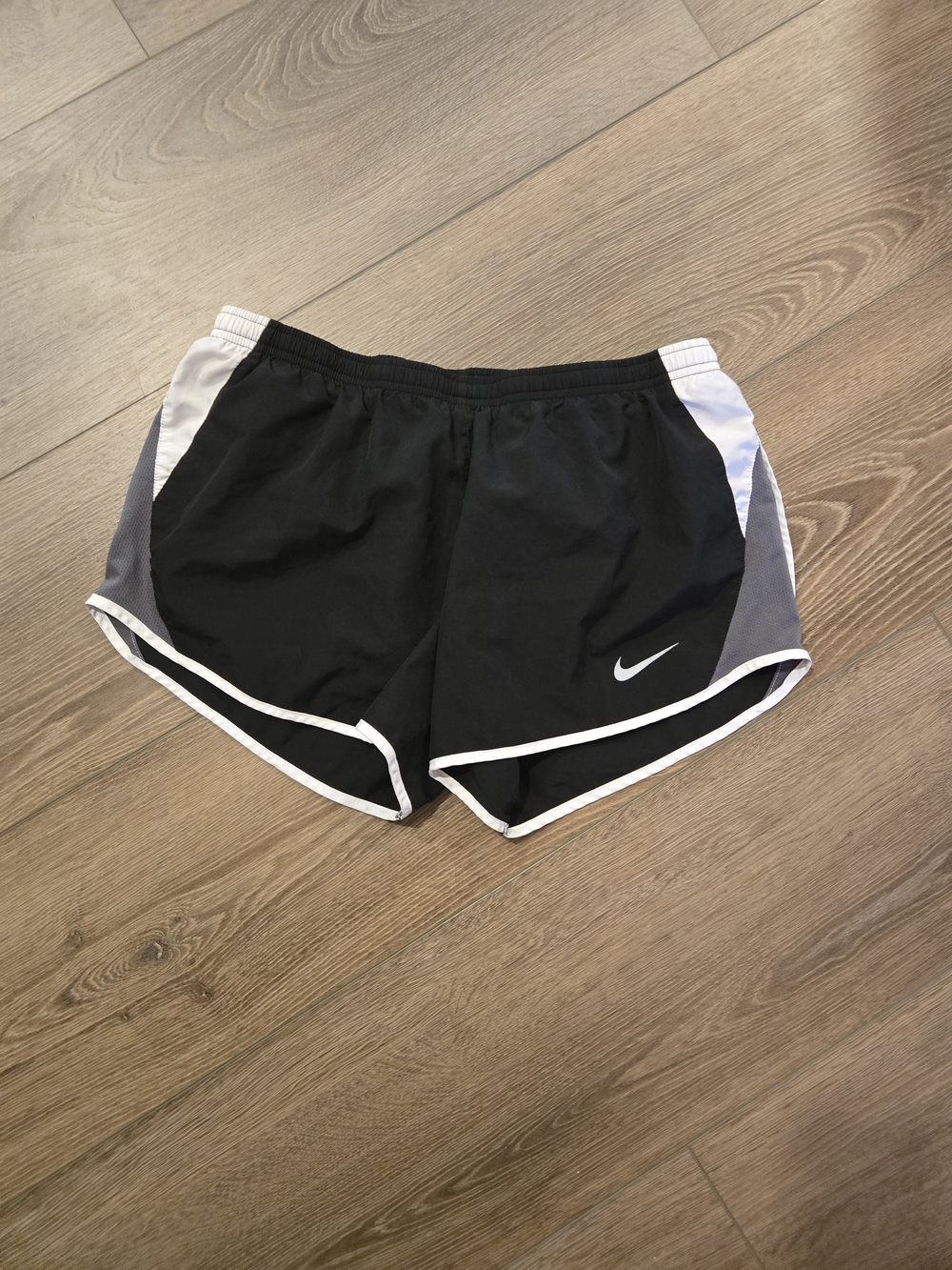 Nike Women's Black Athletic Shorts with White Trim and Gray Panels